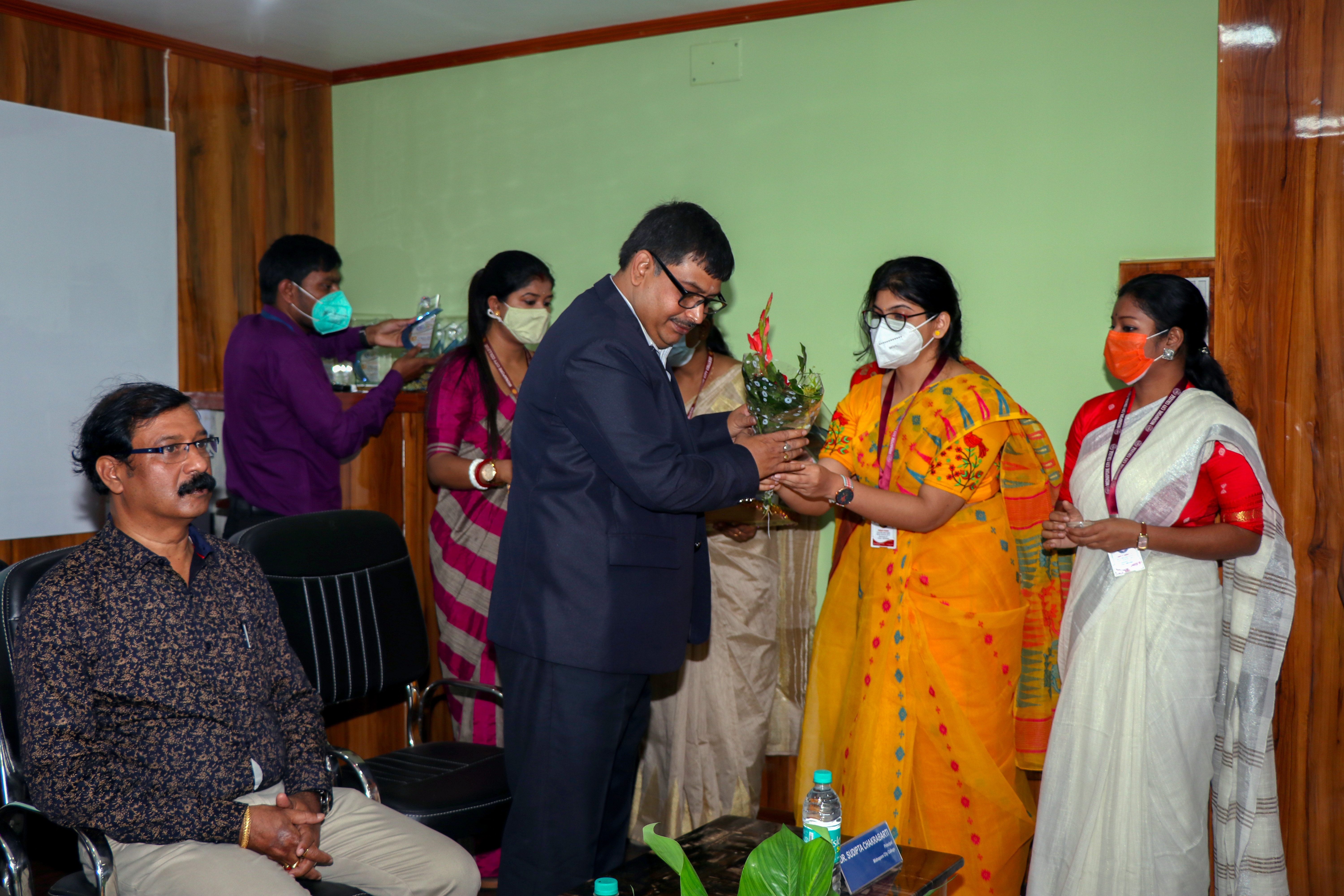 13 / 17 , Students are felicitating the Honorable Principal